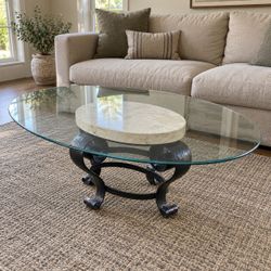 Oval Glass Coffee Table – Stone & Black Scrollwork Base