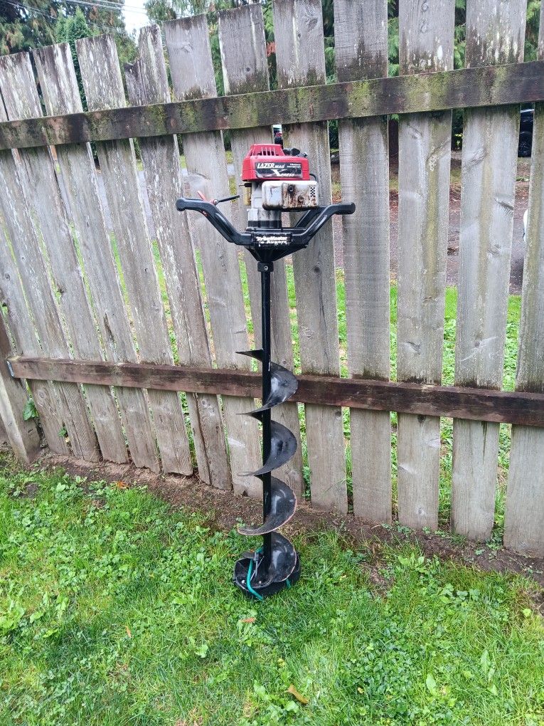 ice auger with 8" bit and its 53 ins tall runs great 