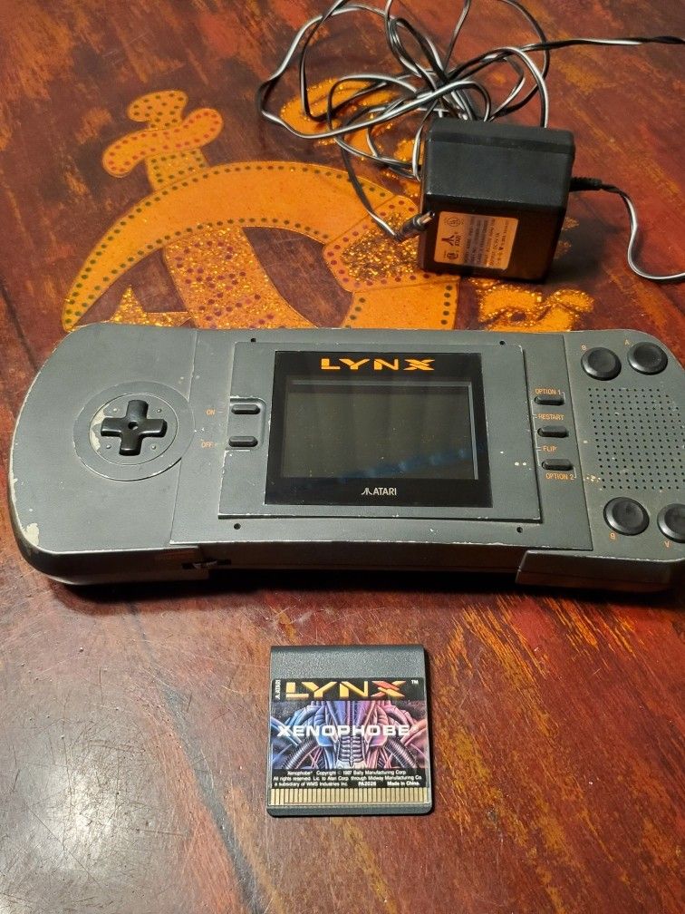 Atari Lynx With Game And Adapter. Works