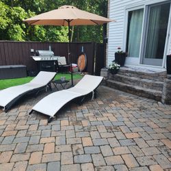 East Village Outdoor Wicker Lounge Chairs With Umbrella And Table