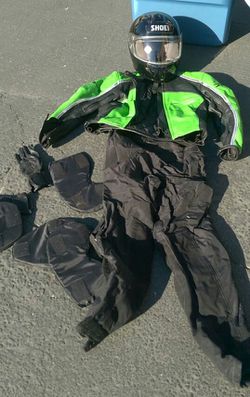 Smaller female street bike riding gear. Leather top, wind resistant lower padded pants and helmet