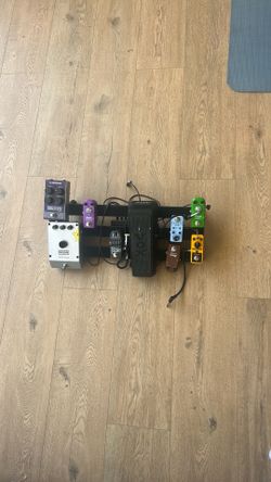 Collection of guitar  pedals with pedal board.  *except talkbox *