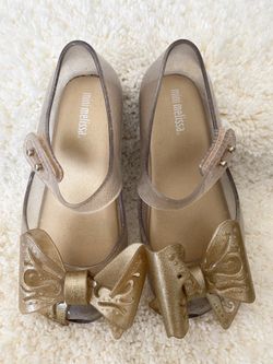 Mini Melissa Gold Glitter Bows Size 10