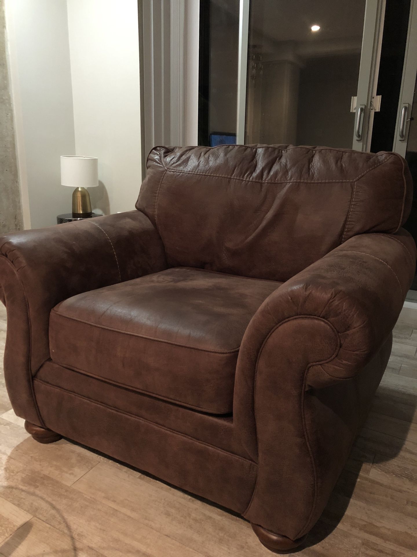 Comfortable leather couch and ottoman in good condition