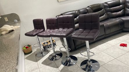 Four adjustable counter chairs