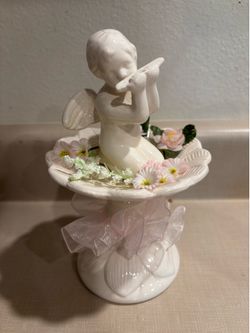 Cupid on a stand figurine