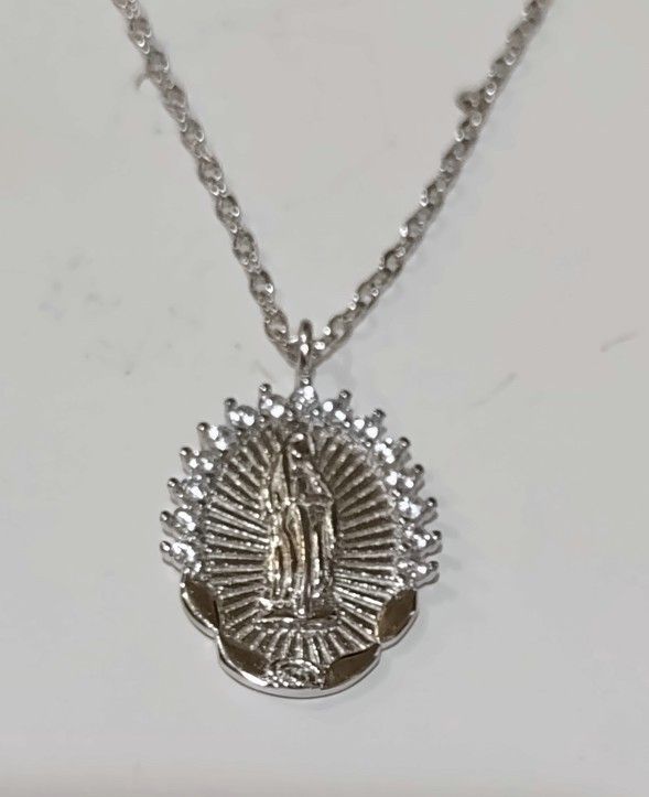 Sterling silver Virgin Mary necklace. The necklace 18" long