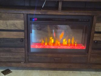 Entertainment center holds large tvs