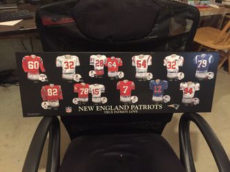 New England Patriots jerseys wooden sign