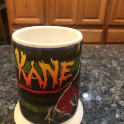 Official Wrestling Federation Collector Cup / Mug “ Kane”.  Year 2001.  Brand New Never Used.  Dishwasher and microwave safe.  Made by the Danbury Min