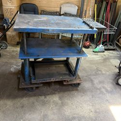 HEAVY DUTY METAL CART ,IT HAS ONE SLIDING SHELF. THE HIGHT IS ADJUSTABLE. $150.00 OR BEST OFFER.