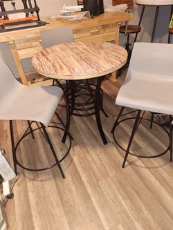 New 28 inch table and 3 swivel chaors