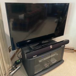 Samsung LED Tv, Vizio Soundbar, Panasonic DVD Player, Cabinet On Wheels
