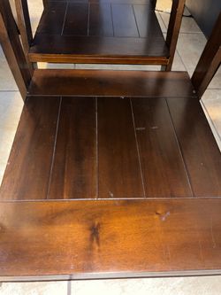 Ashley 3 piece table set, gray top with wooden bottom