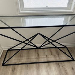 Glass and black metal console table