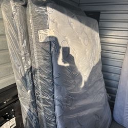 Full-size mattress and boxspring, brand, new and plastic