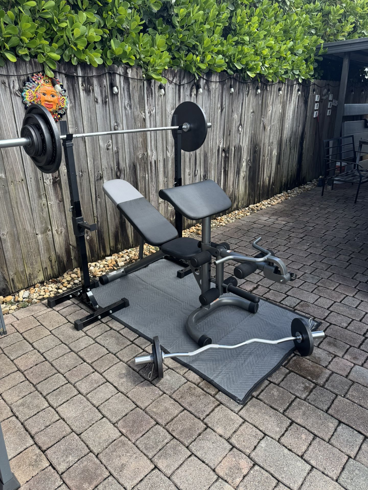 2” Olympic Style Workout Set with spotter arms and over 250lbs in total weight. Everything in pics is included. YES ITS AVAILABLE
