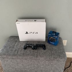 PS4 with controllers and charging dock