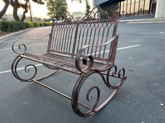 Rustic metal rockinv bench