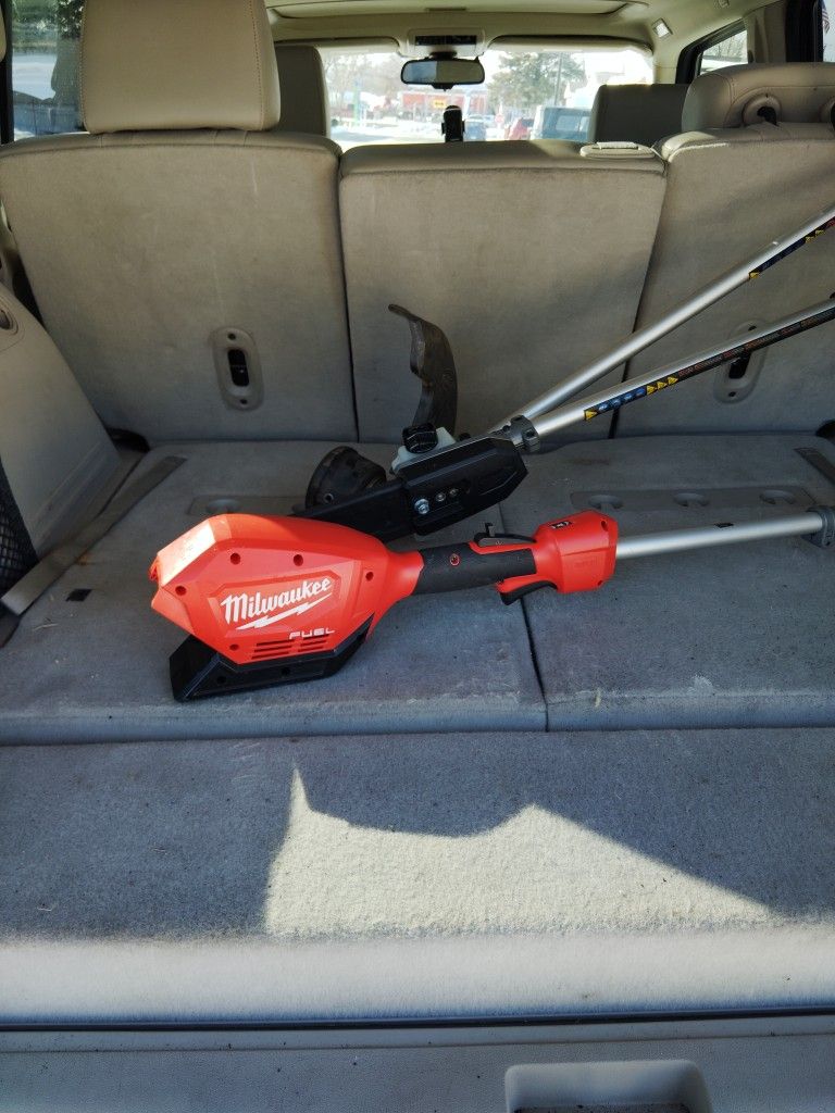 Milwaukee mower combined with a chainsaw