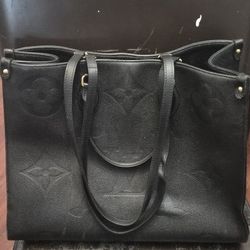 Louis Vuitton Monogram Empreinte OnTheGo GM tote bag in black leather.