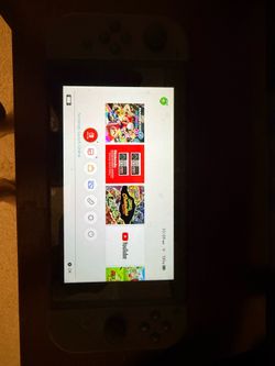 Nintendo switch with Mario kart 8, Mario sonic Olympics and Mario golf