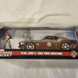JADA METAL DIECAST CAR 1:32 SCALE.  MARVEL GUARDIANS OF THE GALAXY.  STAR LORD.  1969 FORD MUSTANG AND STAR LORD METAL DIECAST FIGURE. 