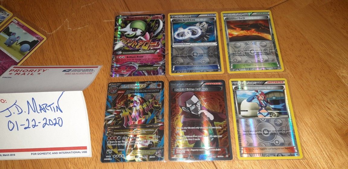 81 Holo and Reverse Holo Pokemon cards including one Primal...