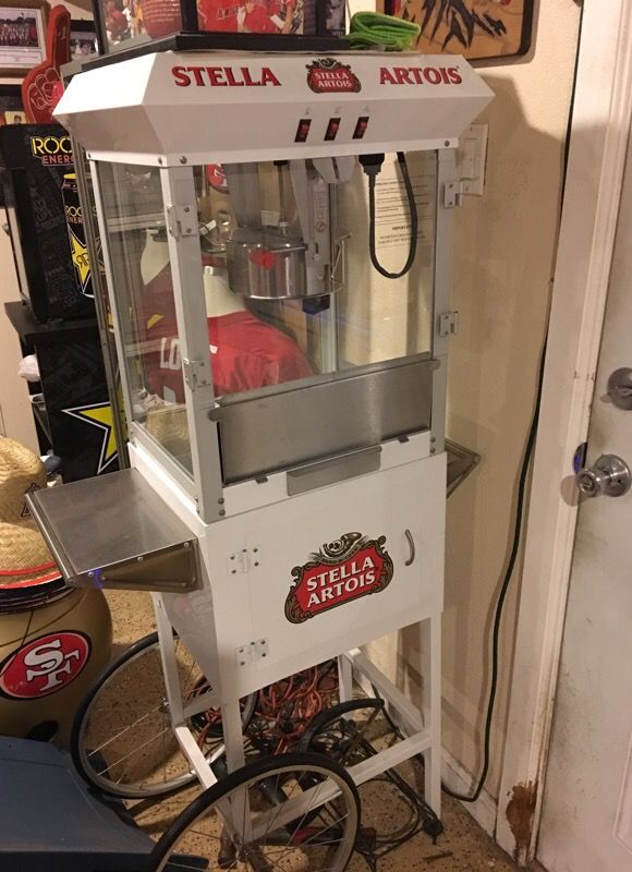 Stella Artois popcorn machine and light. Man cave