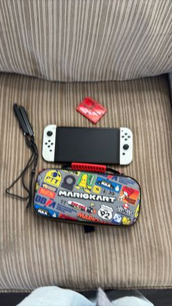 Switch oiled very good condition comes with case and games