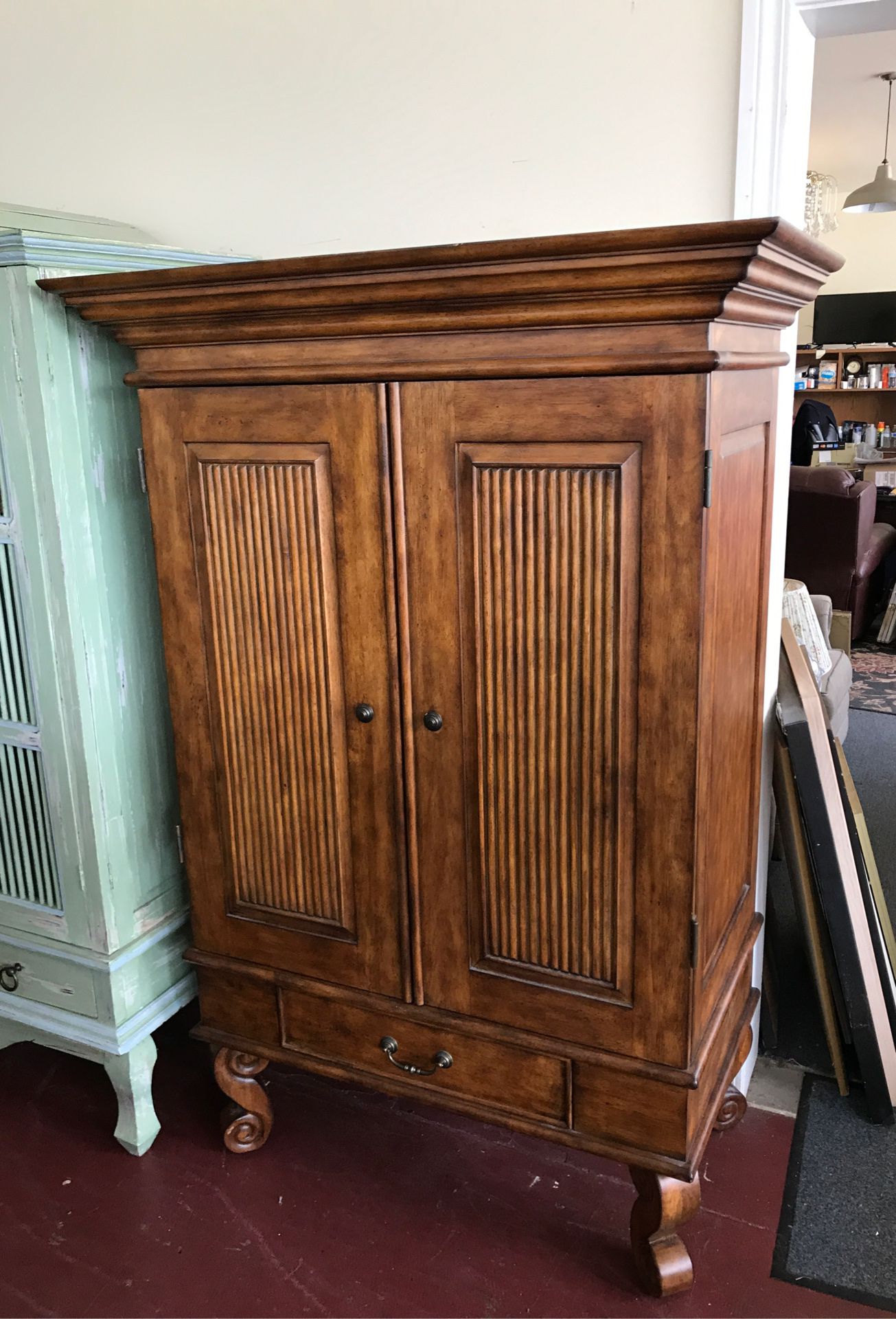 Real nice solid wood clothes armoire or TV armoire has three shelves lots of storage