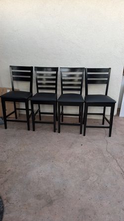 4 black high chairs