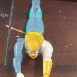 Jack in the Box Aquaman wind-up toy, possibly from a 1999 DC Super Heroes set.
