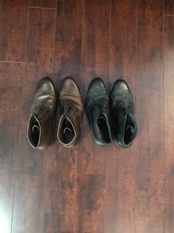 Brown and black wingtip boots