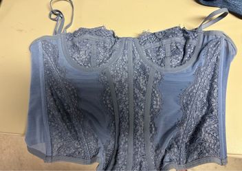 Blue lace corset top with floral design, size medium