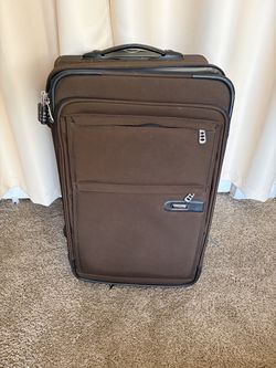 Brown suitcase /luggage on wheels with compartments