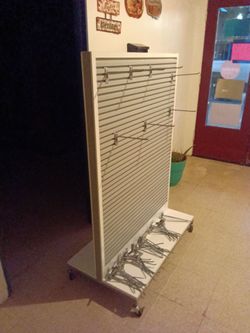 Commercial Display Rack W/wheels includes 50 hooks Great Cond