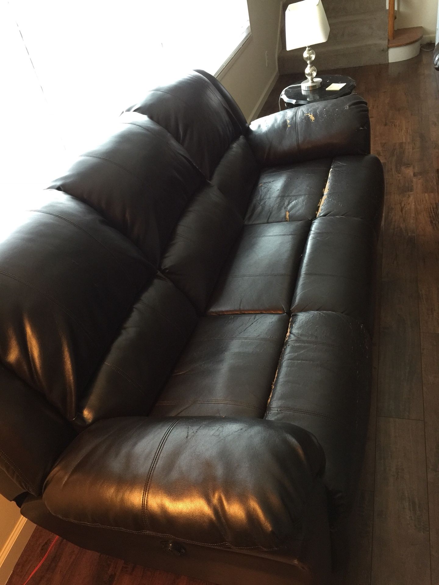 Black leather couch and love seat