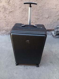 Large hard sided rolling luggage