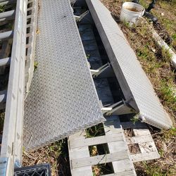 Diamond plate aluminum bi fold trailer ramp.