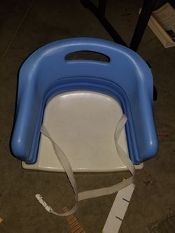 Blue-booster seat fits most chair