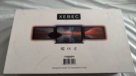 Xebec Tri-Screen, a portable dual-monitor workstation designed to attach to a laptop.
