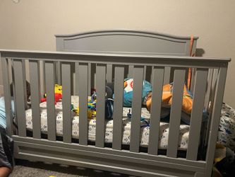 Grey baby crib