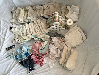 17 Charlie Banana adjustable cloth diapers, sealed disposable liners & diaper accessories