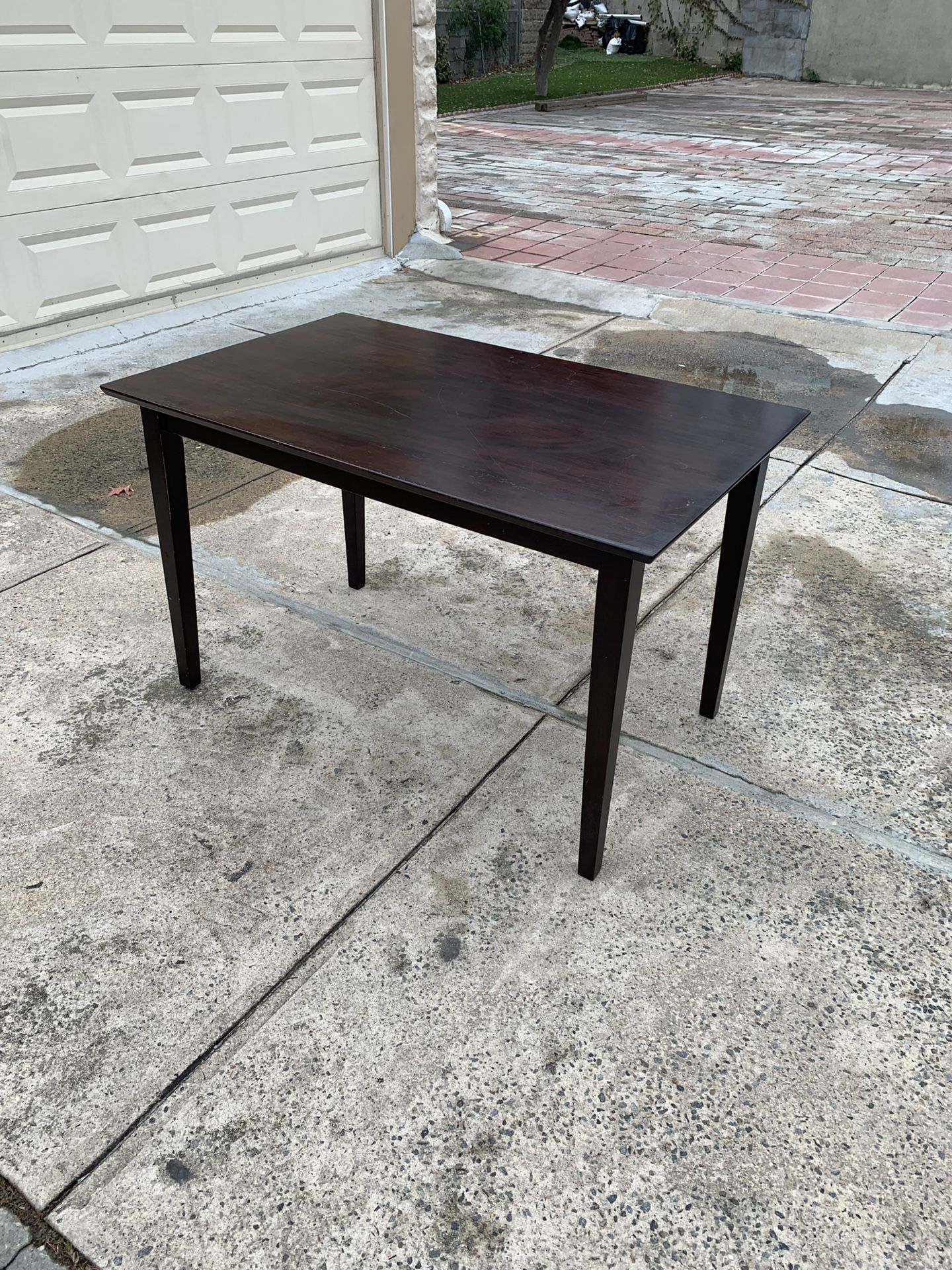 Dark wood dining or kitchen table