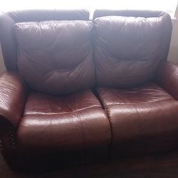 Brown leather Reclining Loveseat And Sofa.  