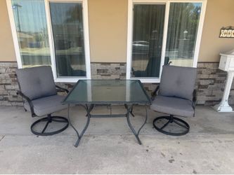 Table and 2 swivel chairs