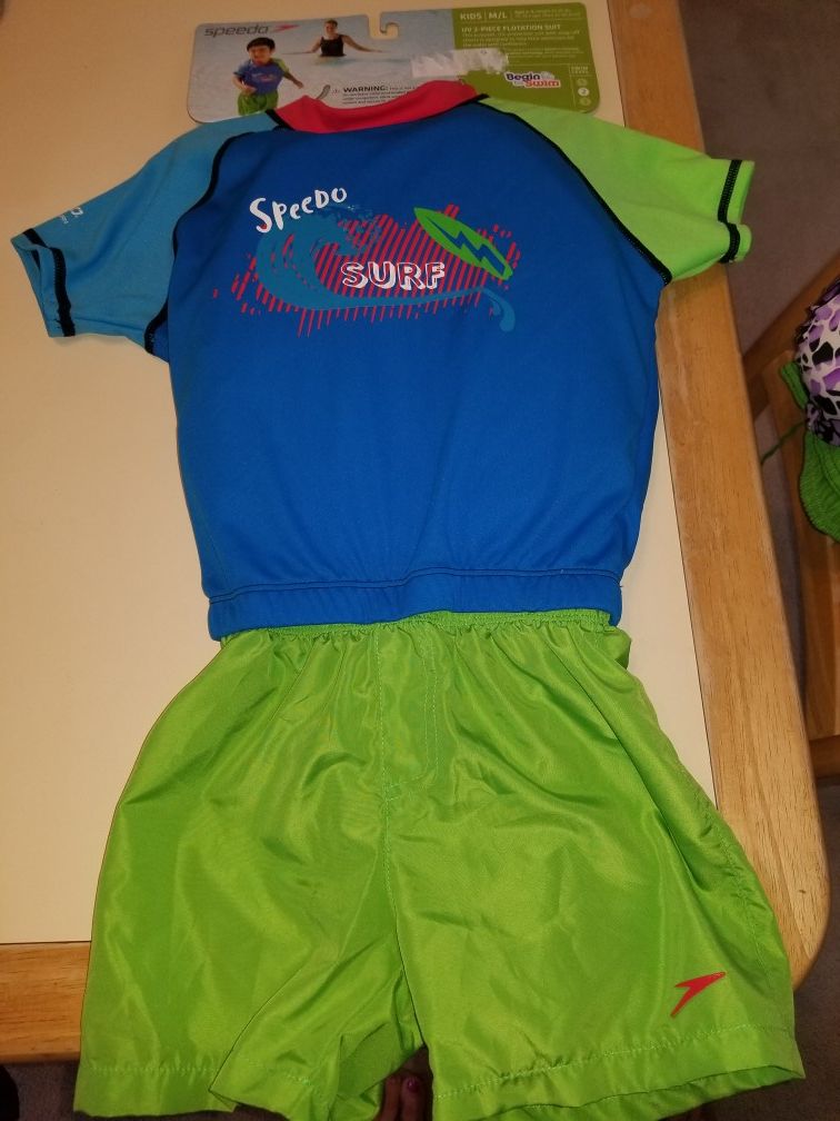 NEW WITH TAGS SPEEDO KIDS SPF50 SIZE M/L WEIGHT 35-45 . 2 PIECE FLOTATION SUIT. PICK UP MIDDLEBORO ONLY