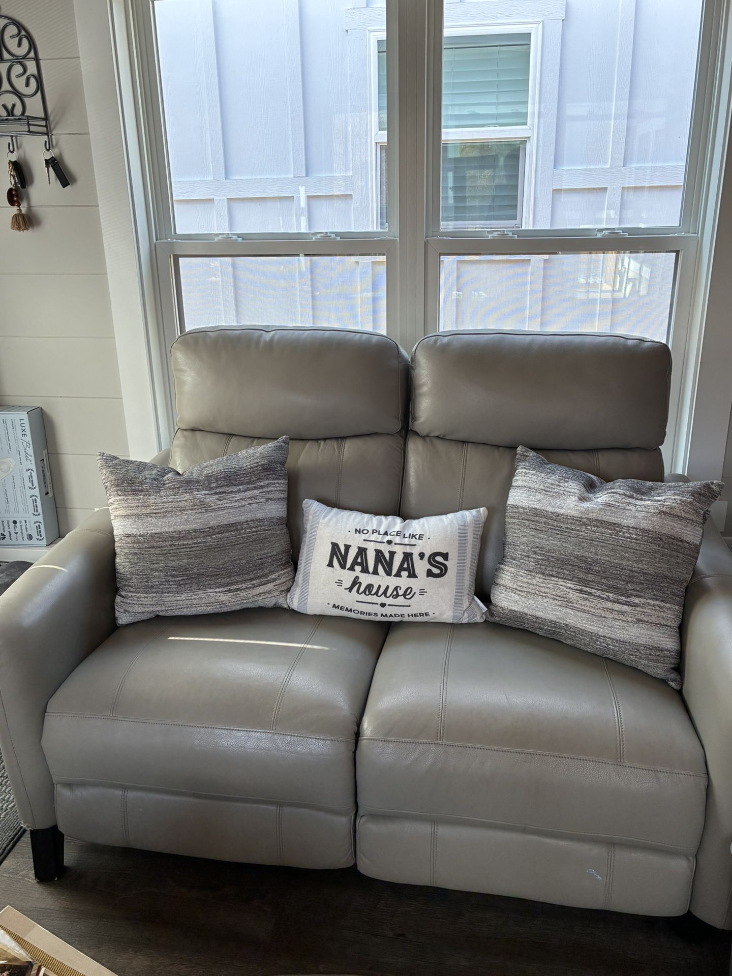 Gray/beige leather loveseat, recliner and dual head rest