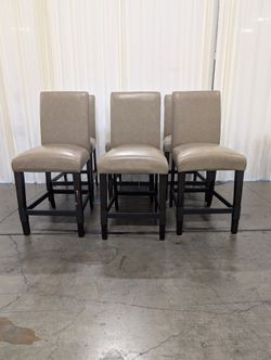 Set of six Tan Upholstered Backrest Bar Stools